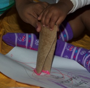 We stamped red and pink hearts with toilet paper roll tube creased to form a heart. I was quite surprised how easily kuttyma got the concept of stamping 