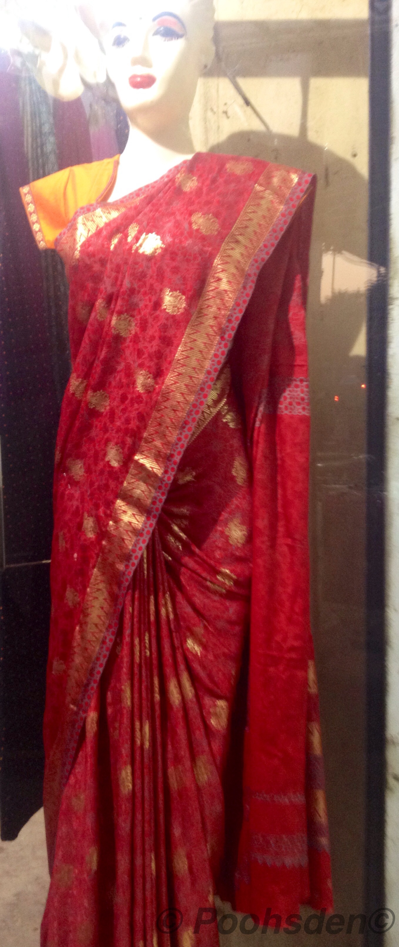 A mannequin at a clothing store in Chennai clad in a red saree