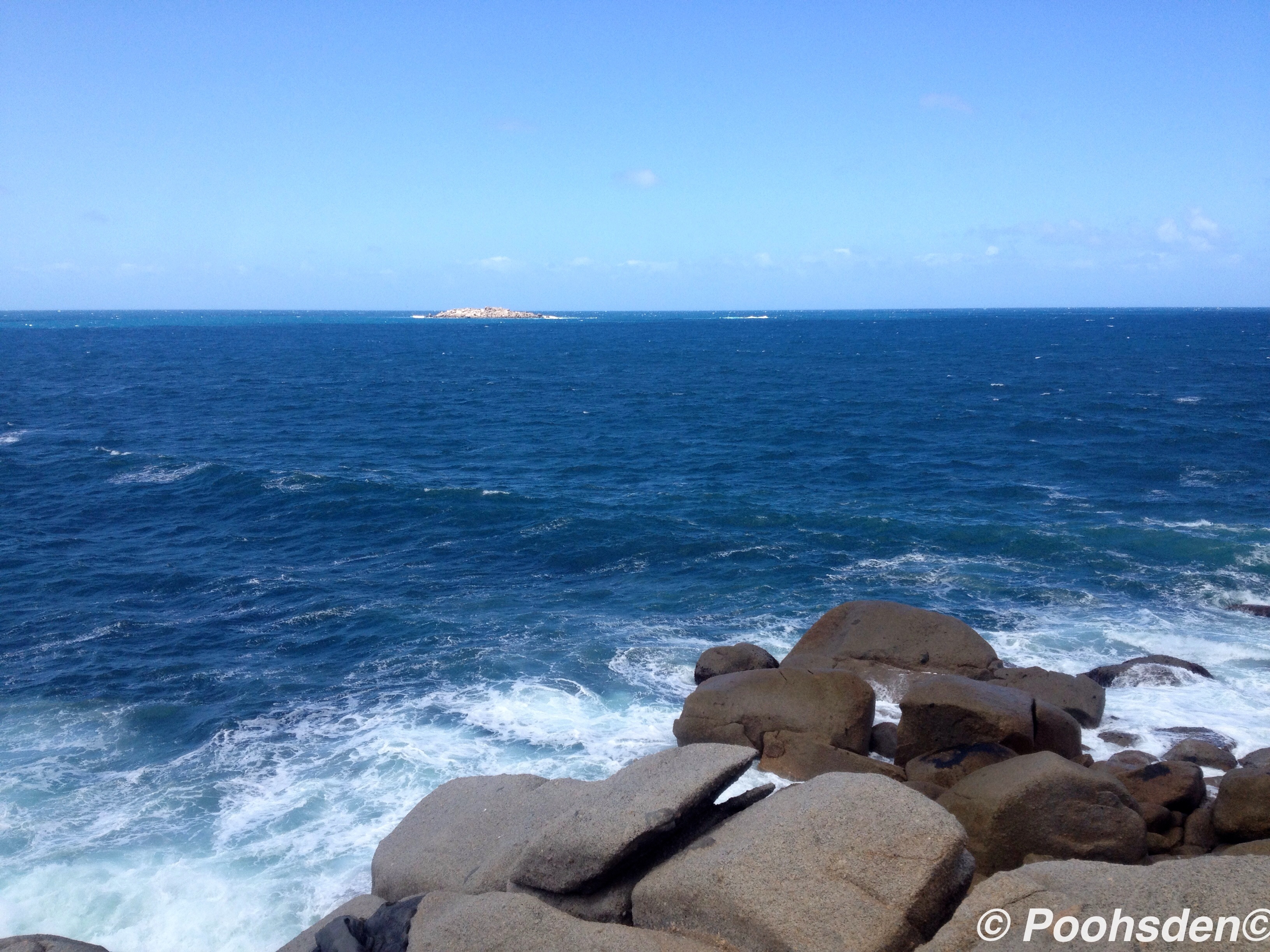 Waves smashing the huge granite rocks at Granite Island. 